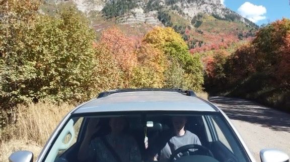 Driving a mountain road in autumn
